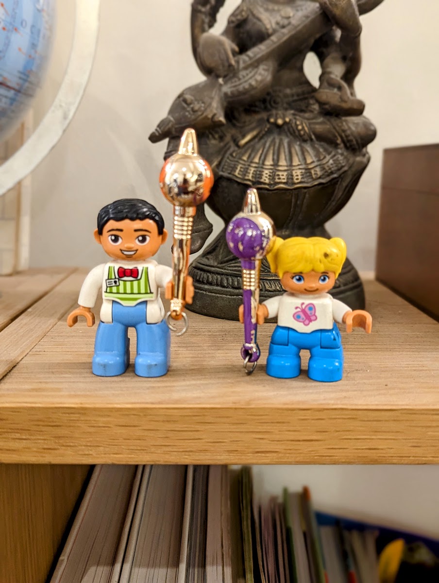 Lego pieces that denote Father and daughter with Hanuman Gada